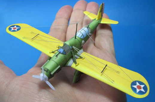 tiny paper a-8 shrike model on a hand