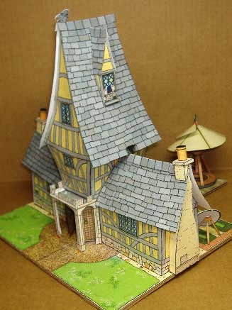 finished story book house complete with Da Vinci medieval helicopter flying machine